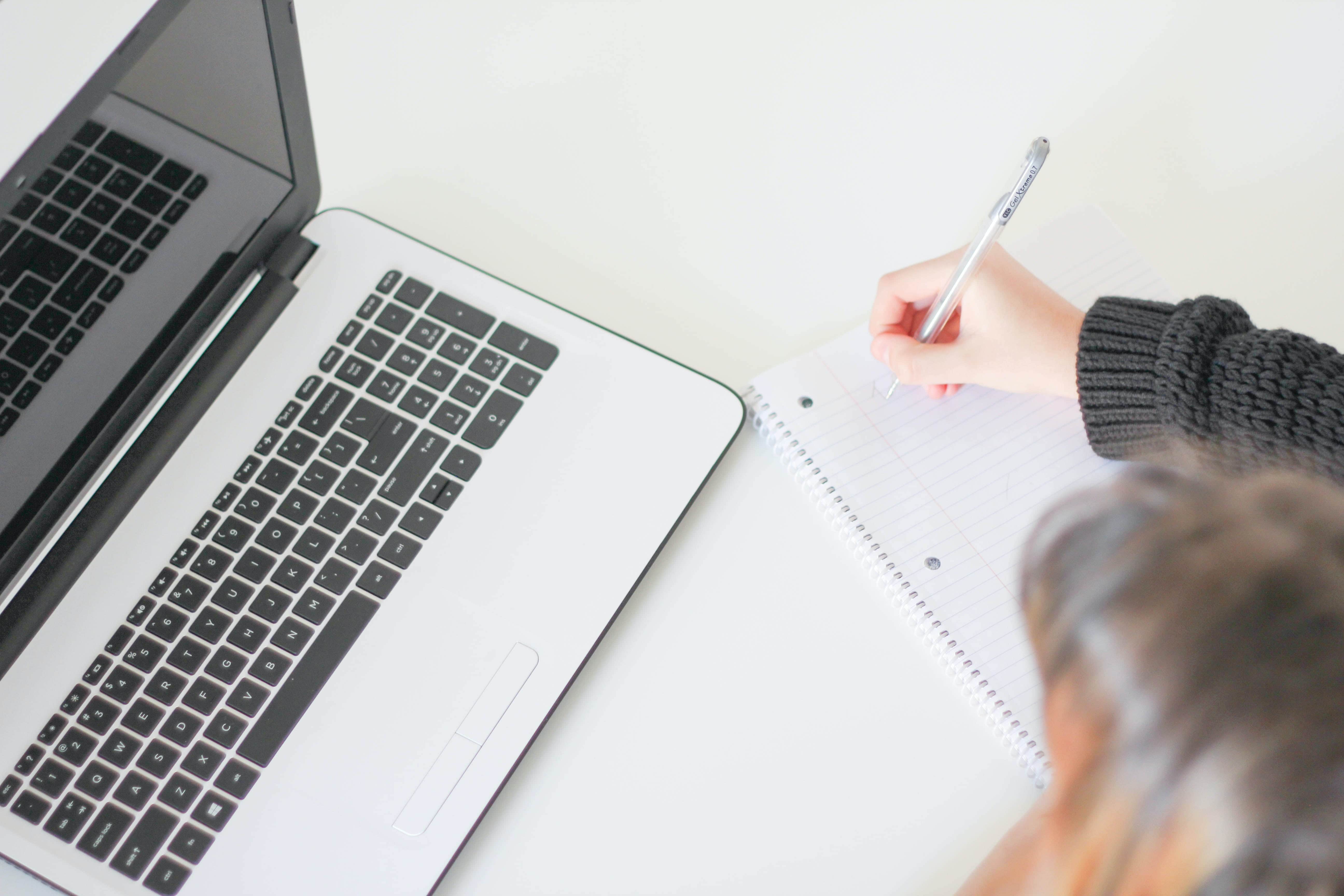 woman writing a checklist